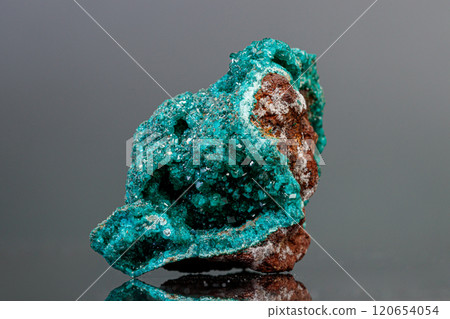 macro mineral stone Dioptase on a gray background 120654054