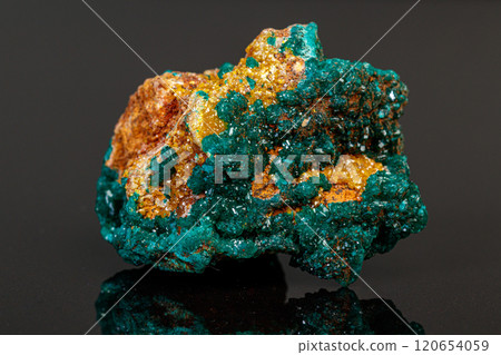 macro mineral stone Dioptase on a gray background macro mineral stone Dioptase on a gray background 120654059