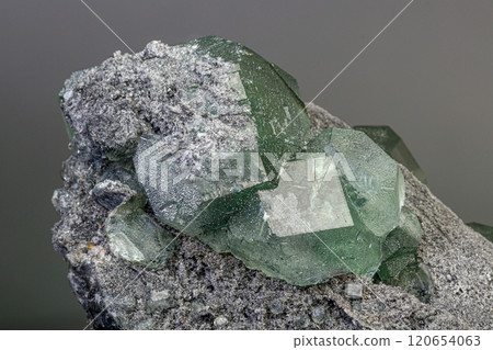 macro mineral stone green fluorite on a black background macro mineral stone green fluorite on a black background 120654063