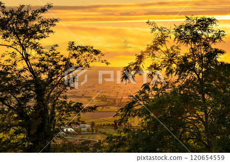 Sunset views with orange sky, from the town of Cortona, Arezzo, Tuscany 120654559