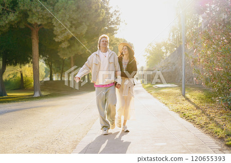 A Happy Couple Thriving and Enjoying a Beautiful Sunny Day Together Outdoors in Nature A Happy Couple Thriving and Enjoying a Beautiful Sunny Day Together Outdoors in Nature 120655393