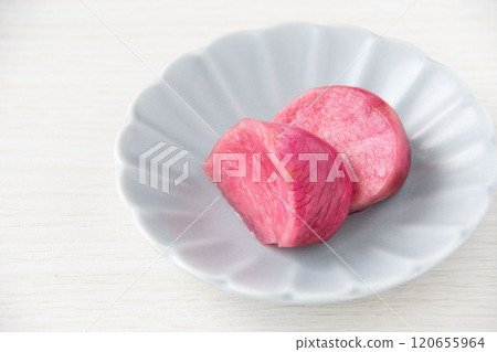Pickled Atsumi turnips served on a small plate 120655964
