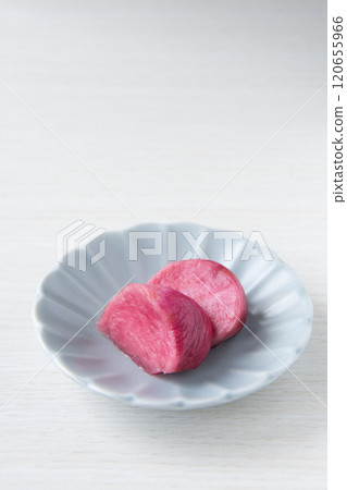 Pickled Atsumi turnips served on a small plate 120655966