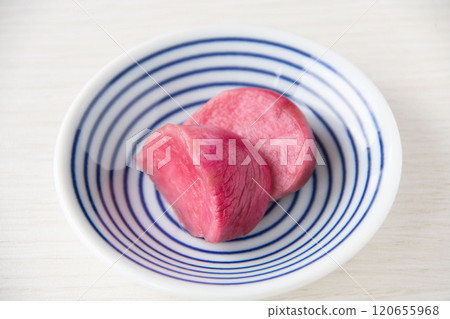 Pickled Atsumi turnips served on a small plate 120655968