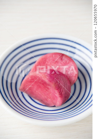Pickled Atsumi turnips served on a small plate 120655970