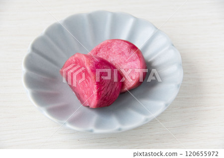 Pickled Atsumi turnips served on a small plate 120655972