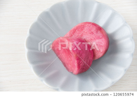 Pickled Atsumi turnips served on a small plate 120655974