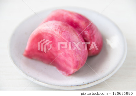 Pickled Atsumi turnips served on a small plate 120655990