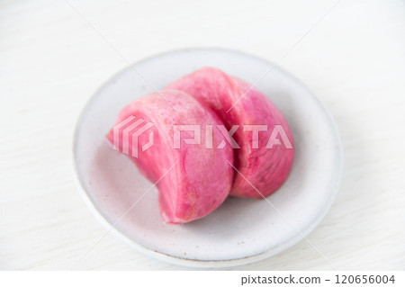 Pickled Atsumi turnips served on a small plate 120656004