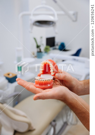 Dental model with braces showcased in a clinic for orthodontic education and oral health awareness Dental model with braces showcased in a clinic for orthodontic education and oral health awareness 120656241