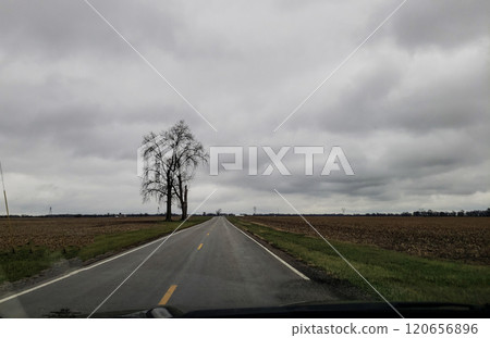 Lonely Country Road During a Cloudy Day in Autumn, Madison County, Ohio 120656896