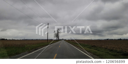 Lonely Country Road During a Cloudy Day in Autumn, Madison County, Ohio 120656899