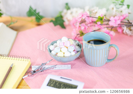 Coffee and a mountain of Ramune are prepared along with study materials. 120656986