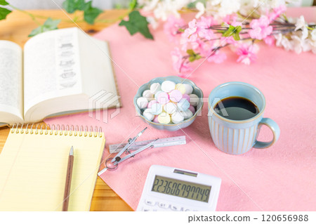 Coffee and a mountain of Ramune are prepared along with study materials. 120656988