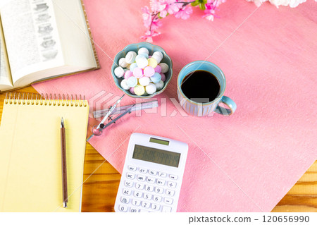 Coffee and a mountain of Ramune are prepared along with study materials. 120656990