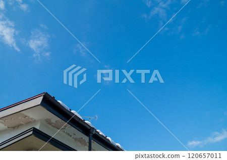 A house with peeling paint on the eaves A house with peeling paint on the eaves 120657011