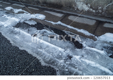 Snowy shady road 120657013
