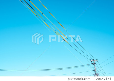 Electric wire protection cover around the construction site and clear blue sky a-4 light tone Electric wire protection cover around the construction site and clear blue sky a-4 light tone 120657161