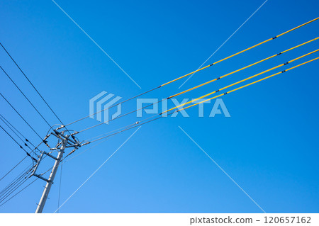 Electric wire protection covers around the construction site and clear blue skies b-1 Electric wire protection covers around the construction site and clear blue skies b-1 120657162