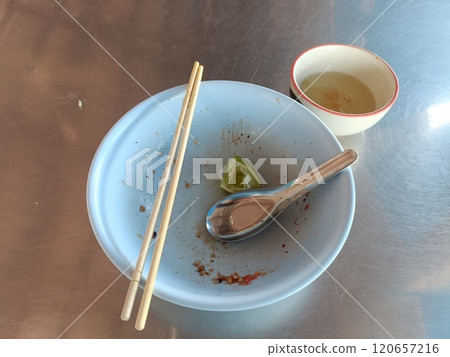 Emtry bowl of noodle after meal on stainless table 120657216