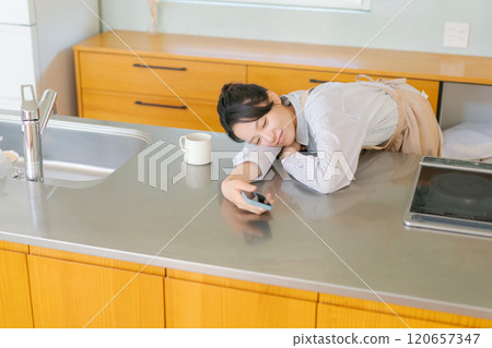 A woman tired of housework 120657347