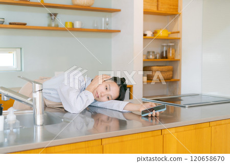 Depressed woman in the kitchen 120658670