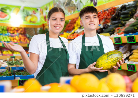 Portrait of friendly salespeople in fruit section of grocery store Portrait of friendly salespeople in fruit section of grocery store 120659271