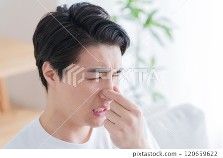 A man picking his nose A man picking his nose 120659622