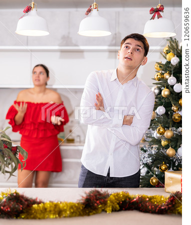 Quarrel of wife and husband during christmas celebration 120659636