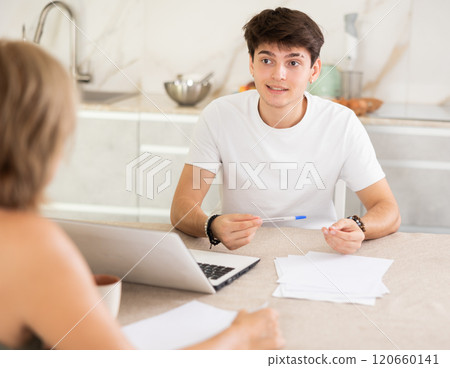 Guy manager tells woman client about specifics of design of microloan, about benefits and advantages Guy manager tells woman client about specifics of design of microloan, about benefits and advantages 120660141