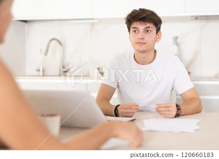 Guy manager tells woman client about specifics of design of microloan, about benefits and advantages Guy manager tells woman client about specifics of design of microloan, about benefits and advantages 120660183