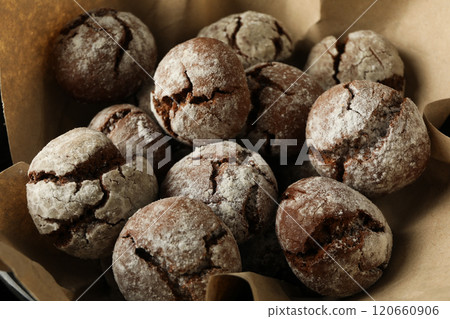 Delicious crinkle cookies in a plate, on a dark background. Delicious crinkle cookies in a plate, on a dark background. 120660906