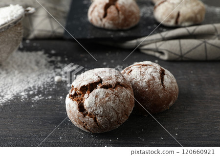 Delicious Grinkle cookies in a glass jar, on a light background. Delicious Grinkle cookies in a glass jar, on a light background. 120660921