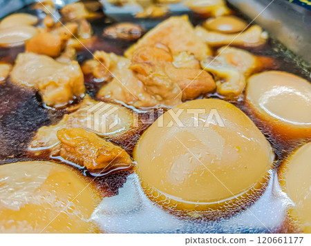 Egg and pork in sweet brown sauce. 120661177