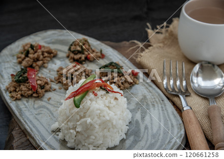 Stir fried Thai basil with minced pork and basil served with steamed rice. Popular traditional food of Thailand. look delicious. 120661258