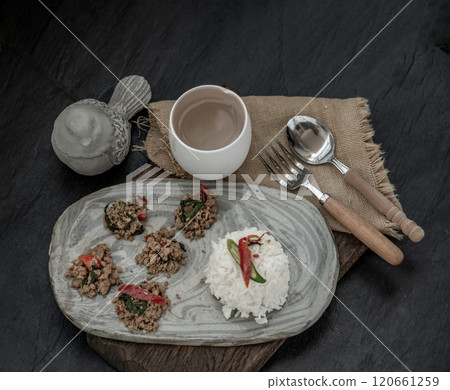 Stir fried Thai basil with minced pork and basil served with steamed rice. Popular traditional food of Thailand. look delicious. 120661259