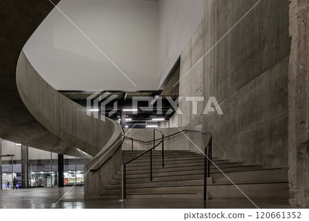 A curving flight concrete spiral staircase at Blavatnik Building of Tate Modern Switch House extension. 120661352