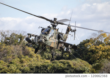 AH-64D combat helicopter in flight AH-64D combat helicopter in flight 120662368