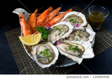 Fresh opened oysters and shripms 120664446