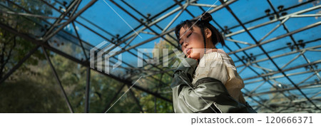 Young Asian woman posing at subway exit.  120666371