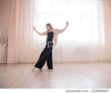 Caucasian woman dancing contemporary in ballet class. Rehearsal. Caucasian woman dancing contemporary in ballet class. Rehearsal. 120666808