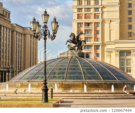 The statue of St. George the Victorious on Manezhnaya Square in Moscow. Urban landscape.     120667494