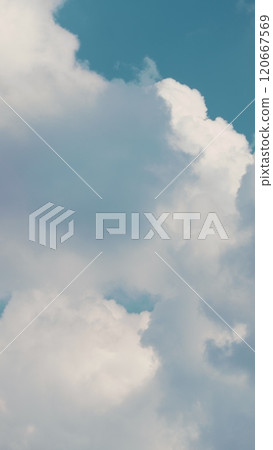 Dense Cumulus Clouds On A Clear Blue Sky. White Clouds In Blue Sky. Picturesque View Of Blue Sky With Fluffy Clouds. Vertical Time Lapse. 120667569