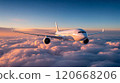 Sleek commercial jet plane soars high above fluffy clouds during a stunning sunset, offering a luxurious and speedy mode of travel through the skies 120668206