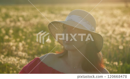 Happy Middle-Age Caucasian Woman Serene And Peaceful In Hat At Sunrise. Cheerful Happy Joyful Woman. Young Girl Wearing A Hat In A Sunset Field. Close Up. Happy Middle-Age Caucasian Woman Serene And Peaceful In Hat At Sunrise. Cheerful Happy Joyful Woman. Young Girl Wearing A Hat In A Sunset Field. Close Up. 120668478