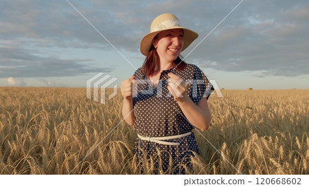Free Woman Enjoys An Evening Sunset In Field. Beautiful Woman With Hat Smiling. Beautiful Healthy Woman, Female Freedom Happiness Portrait. Gimbal shot. 120668602