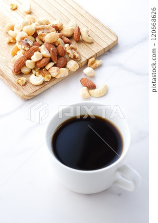 Mixed nuts (almonds, walnuts, cashews, macadamia nuts) and freshly brewed coffee 120668626