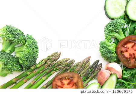 Frame of green vegetables broccoli, arugula, cucumber, asparagus, tomato and garlic on white background with place for inscription 120669175