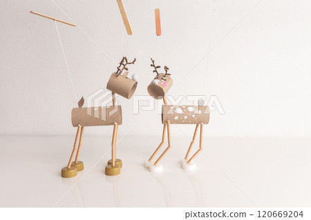 Toilet paper roll craft concept for kid and kindergarten featuring Christmas deer toy DIY tutorial. Recycle art project with cardboard tubes and bottle caps for holiday decor and sustainable crafting, Toilet paper roll craft concept for kid and kindergarten featuring Christmas deer toy DIY tutorial. Recycle art project with cardboard tubes and bottle caps for holiday decor and sustainable crafting, 120669204