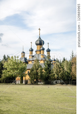 Landscape with Orthodox Christian church in traditional style. Wooden Orthodox church Landscape with Orthodox Christian church in traditional style. Wooden Orthodox church 120669965